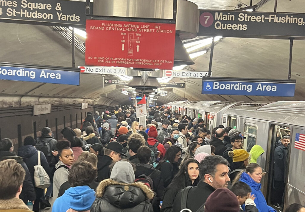 A group of students on a tour in a New York subway station
